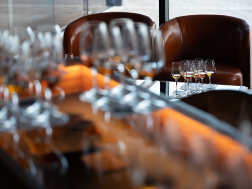 Series of glass wares filled with whisky for tasting - Australian Stock Image