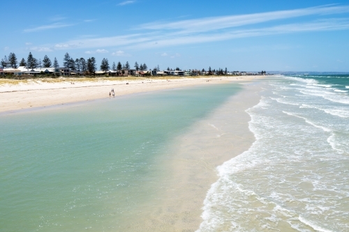 shallow waters and sand bar on city beach - Australian Stock Image