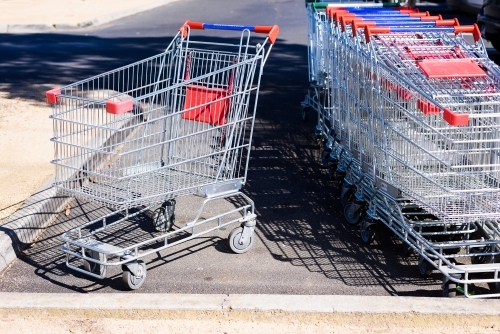 Shopping trolleys parked in an open space. - Australian Stock Image