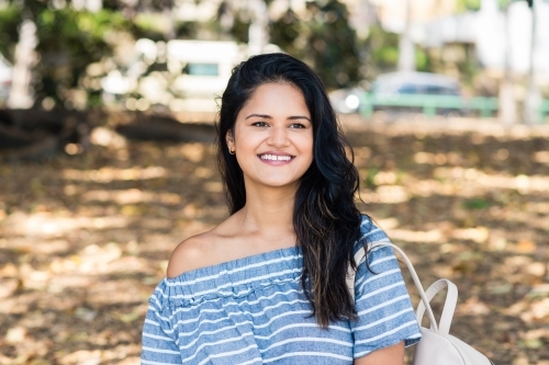 similing woman in a park - Australian Stock Image