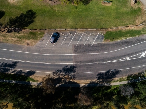 Single car parked in angled parking space seen from above - Australian Stock Image