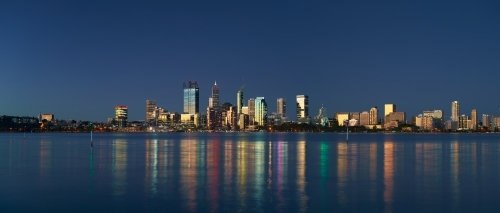 Skyline of downtown Perth, Australia at dusk, with sunset light reflecting off the skyscrapers -2021 - Australian Stock Image