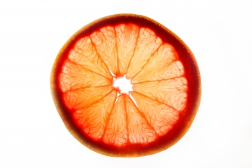 sliced orange on white background - Australian Stock Image