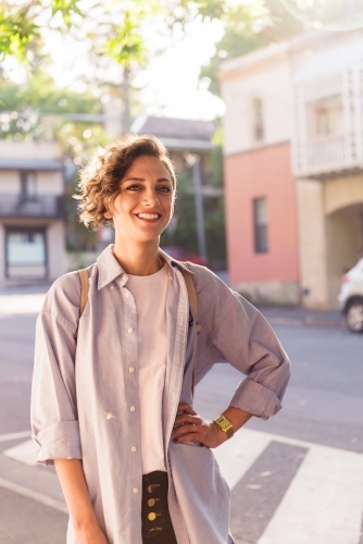 smiling woman in inner city - Australian Stock Image