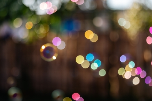 Soft focus background image of bubbles floating in golden morning sunlight - Australian Stock Image