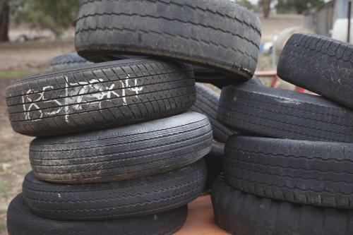 Stack of old tyres for recycling / re-use - Australian Stock Image