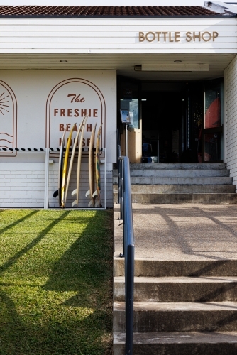 Stairway to coastal bottle shop - Australian Stock Image