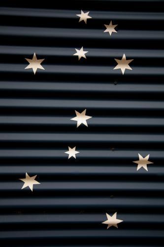 Stars painted on corrugated iron - Australian Stock Image