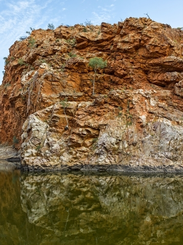 Stone cliffs and pool at Ormiston Gorge and Pound West MacDonnell Ranges - Australian Stock Image