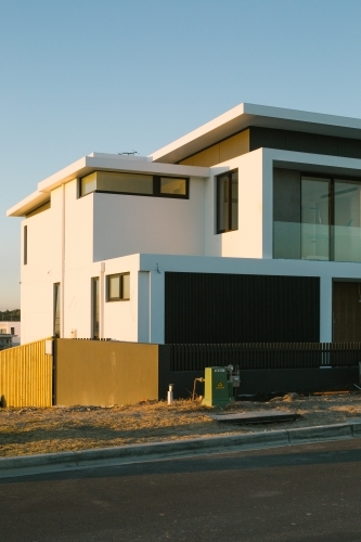 Street view of suburban housing construction development, evening light - Australian Stock Image