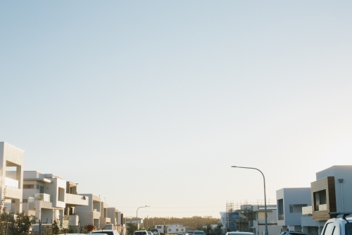 Street view of suburban housing construction development, evening light - Australian Stock Image