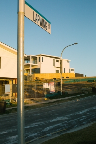 Street view of suburban housing construction development, evening light - Australian Stock Image