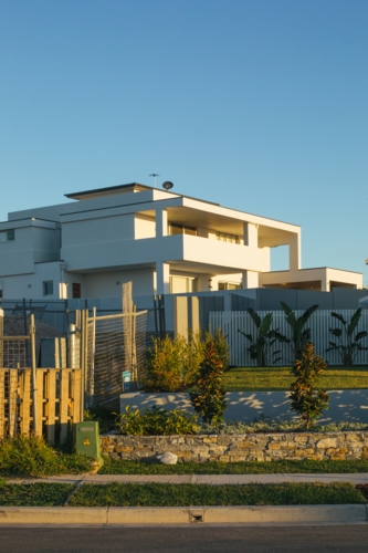 Street view of suburban housing construction development, in evening light - Australian Stock Image