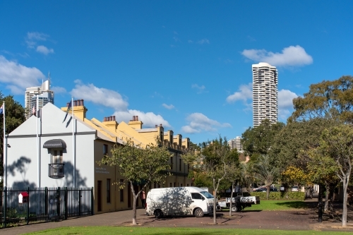 Streetscape in Woolloomooloo with trees and blue sky