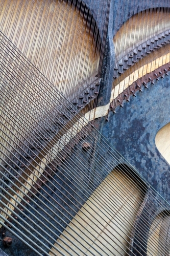 Strings crossing on back of piano - Australian Stock Image