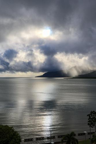 sun breaking through the cloud over the harbour