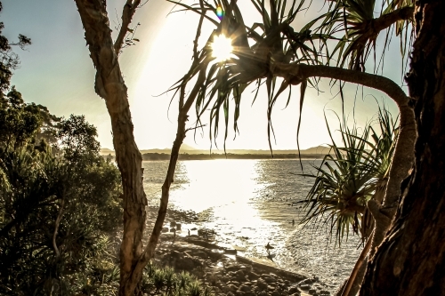 Sun going down on a tropical beach - Australian Stock Image