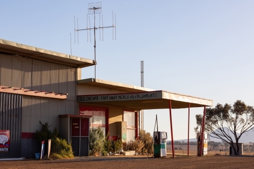 sun shining on deserted outback roadhouse - Australian Stock Image