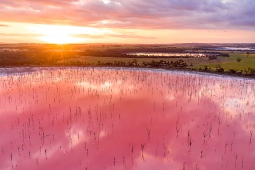 Sunset and a pink salt lake in Western Australia.
