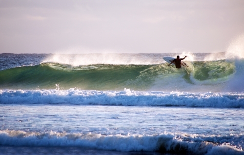 Surfer riding on a wave - Australian Stock Image