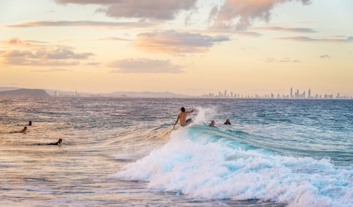 Surfers catching waves - Australian Stock Image