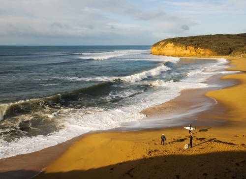 Surfers preparing to enter the surf - Australian Stock Image