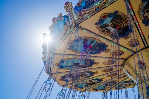 Swing chair ride ornament with sun flare - Australian Stock Image