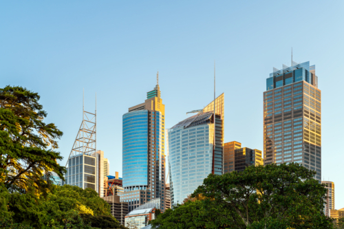 Sydney City skyline at sunset while viewed across Royal Botanic Garden - Australian Stock Image