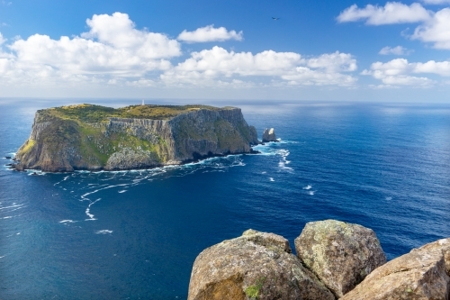 Tasman Island on a sunny day with clouds - Australian Stock Image