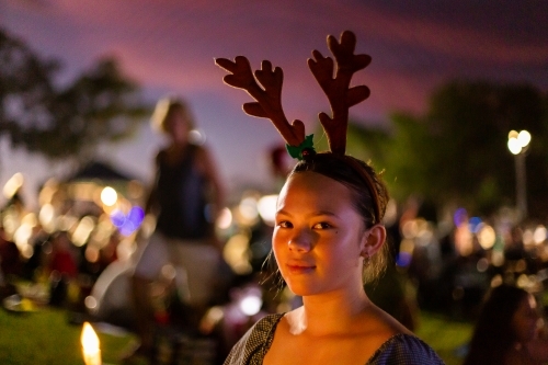 teen girl looking at the camera at christmas carols