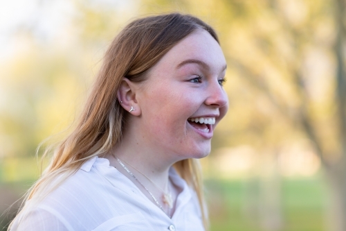Teen girl with long blonde hair and surprised expression - Australian Stock Image