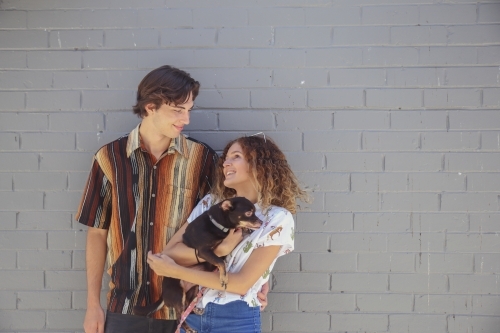 Teenage couple with a dog - Australian Stock Image