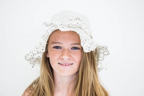 Teenage girl with freckles wearing hat - Australian Stock Image