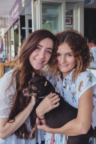 Teenage girls with dog - Australian Stock Image