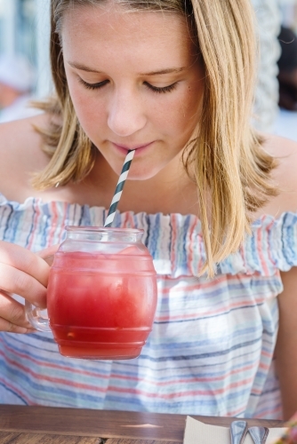 teens at the mall,  drinking juice - Australian Stock Image