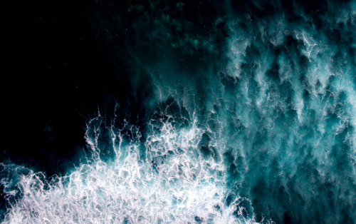 Texture of waves breaking in the ocean - Australian Stock Image