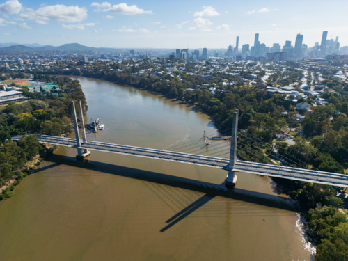 The Eleanor Schonell Bridge crossing the Brisbane River, Brisbane city in background - Australian Stock Image