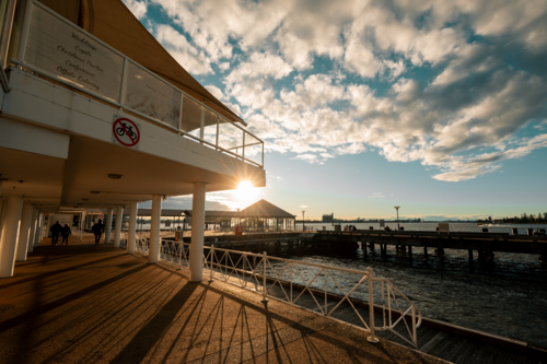 The Queens Wharf ferry terminal in Newcastle bathed in golden afternoon light - Australian Stock Image