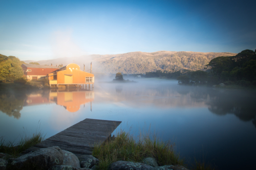 The sun rises over Lake Crackenback on a cold autumn morning in New South Wales, Australia - Australian Stock Image