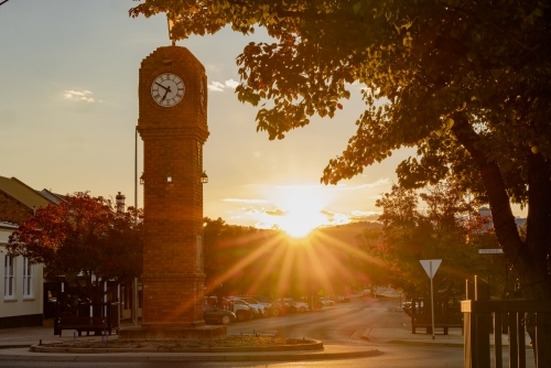 The sun setting behind the Clock Tower in Mudgee NSW - Australian Stock Image