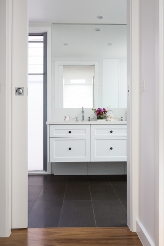 Through the door to a luxury bathroom vanity - Australian Stock Image