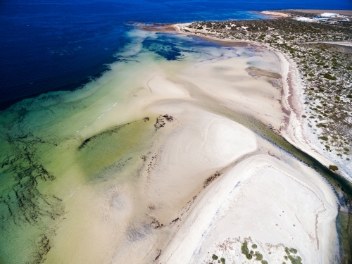 Tidal flats with creek running out to sea - Australian Stock Image