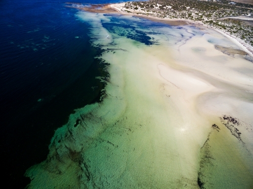 Tidal flats with creek running out to sea - Australian Stock Image