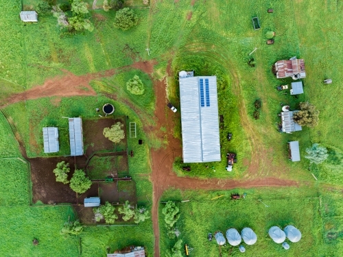 Top down overhead view of farm cattle yards, silos and shed - Australian Stock Image