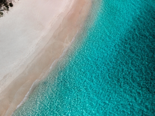 top shot of a white sand beach on a sunny day - Australian Stock Image