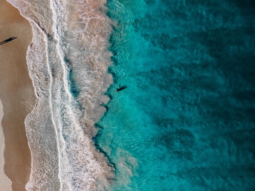 Top view shot of a beach with white sand and waves - Australian Stock Image