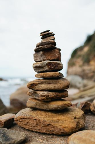 Tower of rock pebbles at the beach - Australian Stock Image