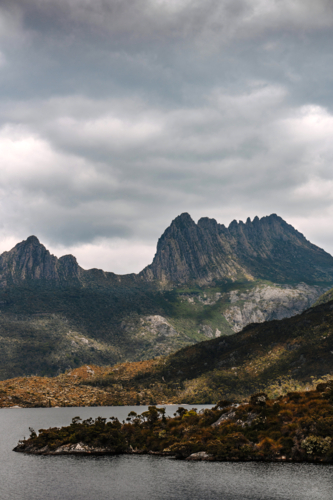 Towering Cradle Mountain peaks with an overcast sky. - Australian Stock Image