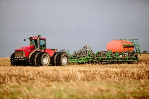 Tractor and plow precision seeding paddock - Australian Stock Image