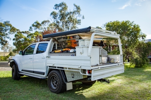 Tradies ute on property with kelpie dog sitting on tray - Australian Stock Image